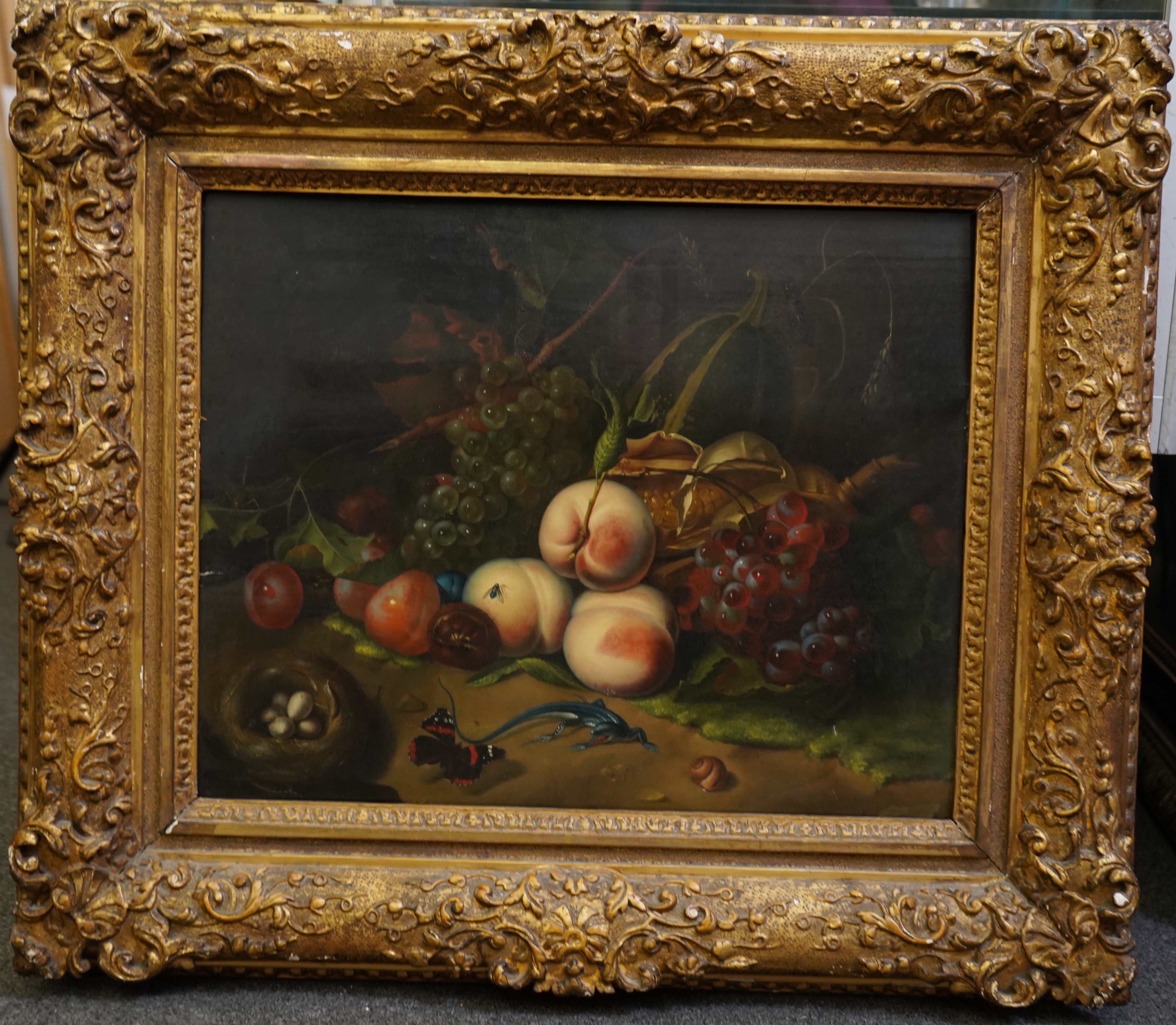 Circle of Rachel Ruysch (Dutch, 1664-1750), Still life of fruit with a lizard, bird's nest and butterfly, oil on wooden panel, 41 x 51cm